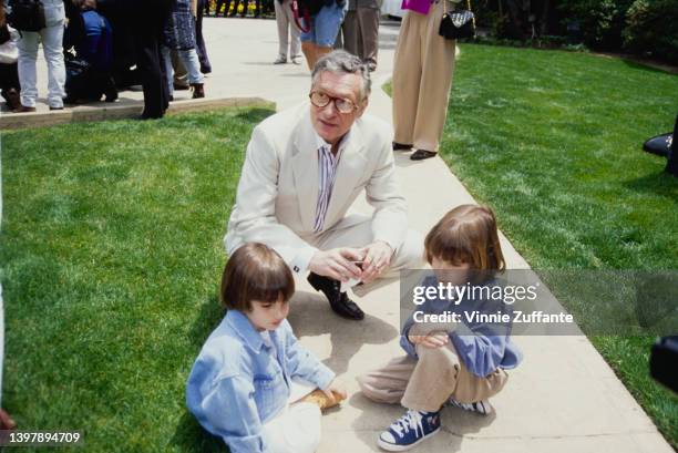 American magazine publisher Hugh Hefner with his sons, Marston Hefner and Cooper Hefner, attend the Playboy magazine Playmate of the Year...