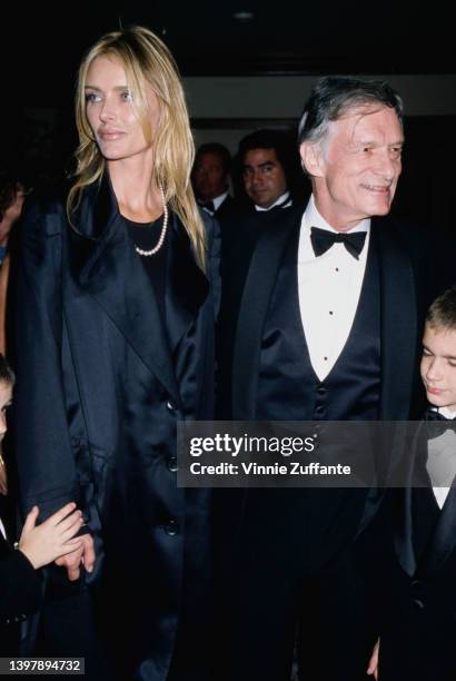 American model and actress Kimberley Conrad and her husband, American magazine publisher Hugh Hefner attend the presentation of Hefner's Friars Club...