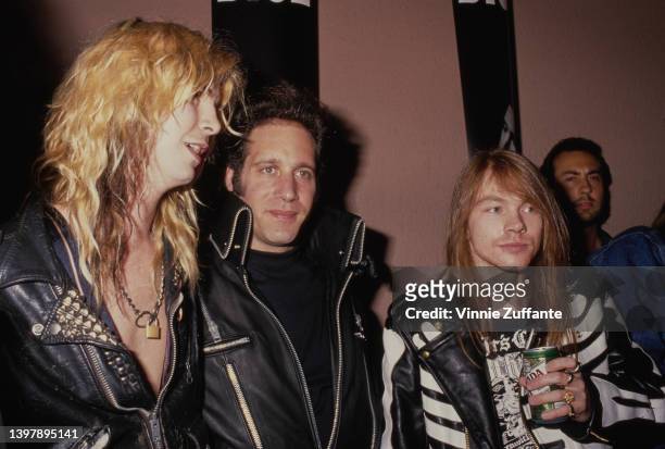 American guitarist and songwriter Duff McKagan, American comedian Andrew Dice Clay, American singer-songwriter Axl Rose, wearing a black leather...
