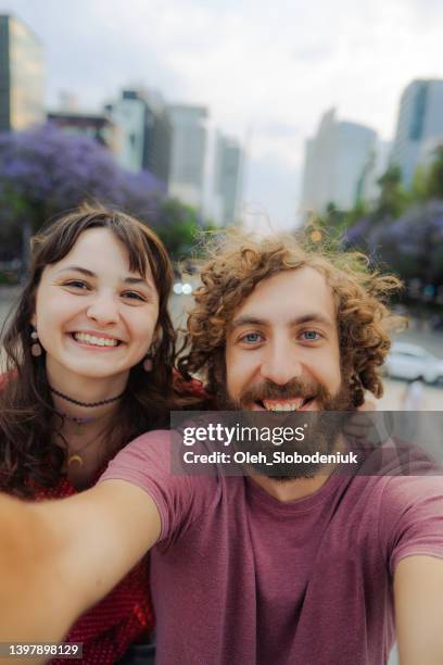 selfie of man and woman on the background of mexico city - mexico city tourist stock pictures, royalty-free photos & images