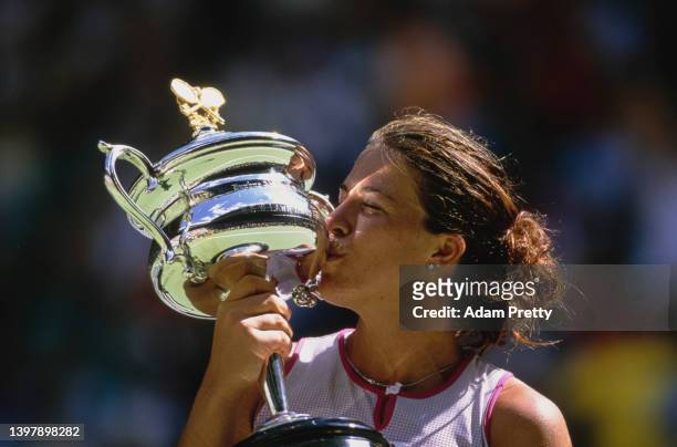 Jennifer Capriati from the United States kisses the Daphne Akhurst Memorial Cup after defeating Martina Hingis of Switzerland in the Women's Singles...