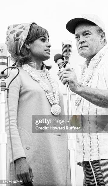 American singer and actress Barbara McNair and British-born American comedian & media personality Bob Hope perform onstage during Christmas show as...