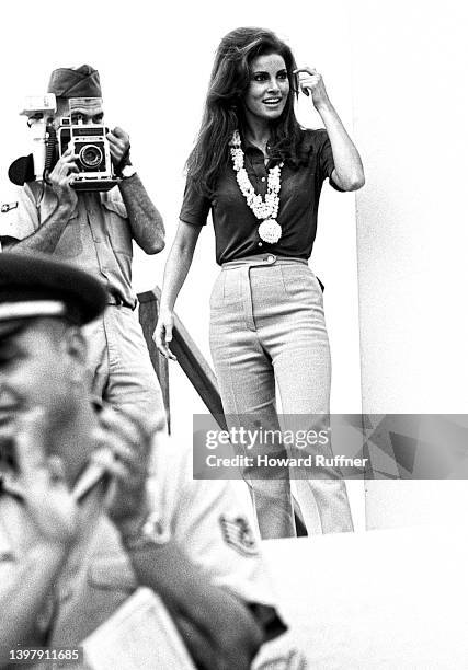 American actress Raquel Welch walks onstage during Christmas show as part of a USO tour at Clark Air Base, Luzon, Philippines, December 28, 1967....