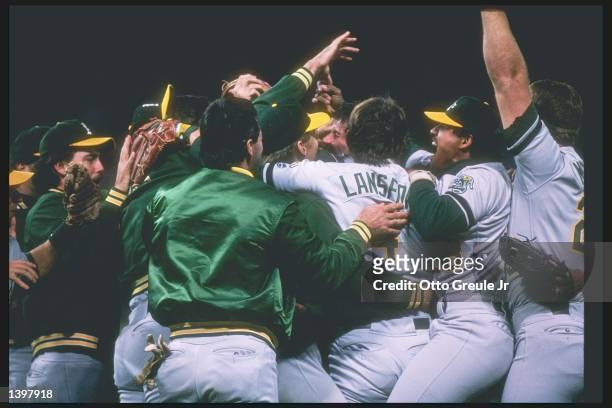 Members of the Oakland Athletics celebrate after a playoff game against the San Francisco Giants