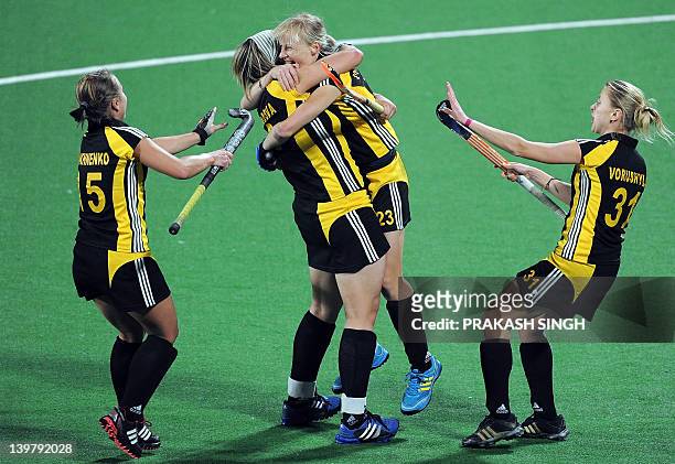 Ukrainian players celebrate a goal during the women's field hockey match between Italy and Ukraine for the third position at the FIH London 2012...