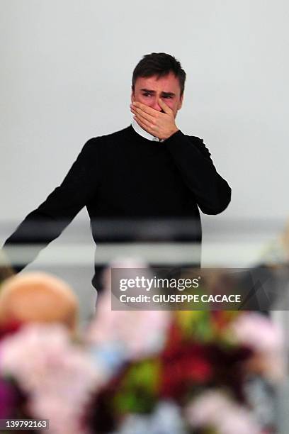 Belgian designer Raf Simons cries at the end of the Jil Sander Fall-winter 2012-2013 collection on February 25, 2012 during the Women's fashion week...