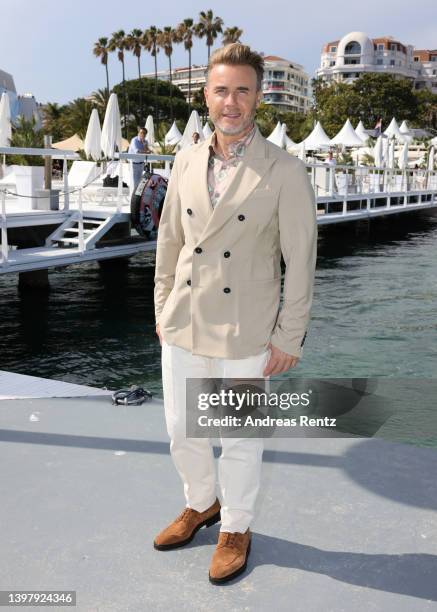 Gary Barlow, member of the Take That, attends the photocall of "Greatest Days" during the 75th annual Cannes film festival at Majestic Beach Pier on...