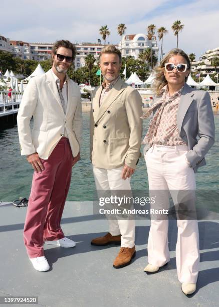 Howard Donald, Gary Barlow and Mark Owen of Take That attend the photocall of "Greatest Days" during the 75th annual Cannes film festival at Majestic...