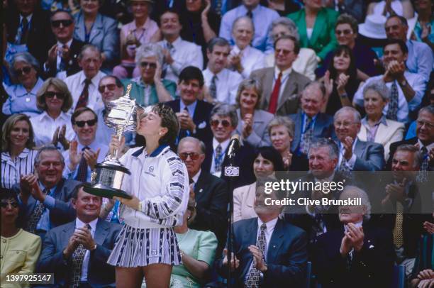 Martina Hingis of Switzerland kisses the Daphne Akhurst Memorial Cup after defeating Mary Pierce of France in the Women's Singles Final match at the...