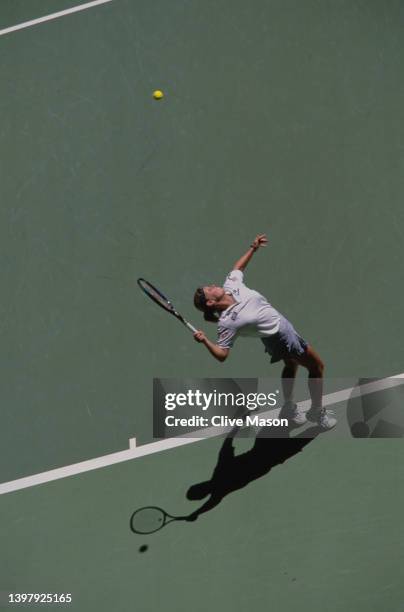 Anke Huber from Germany reaches to serve to Mary Pierce of France during their Women's Singles Fourth Round match at the Australian Open Tennis...