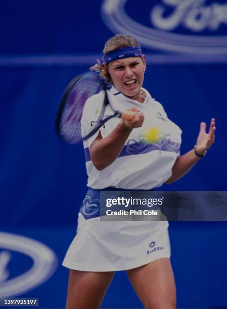 Anke Huber from Germany plays a forehand return to Monica Seles of the United States in their Women's Singles Final match at the Australian Open...