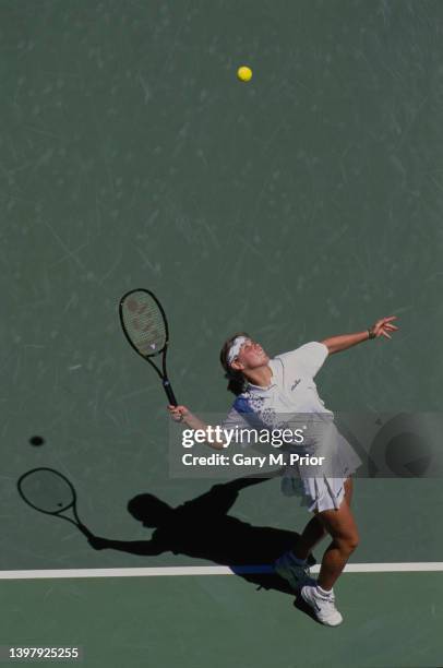 Anke Huber from Germany reaches to serve to Mary Pierce of France during their Women's Singles Fourth Round match at the Australian Open Tennis...