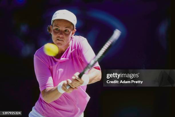 Lindsay Davenport from the United States plays a double handed backhand return to Silvia Farina Elia of Italy during their Women's Singles Third...