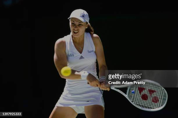 Martina Hingis from Switzerland plays a double handed backhand return to Gréta Arn of Germany during their Women's Singles Second Round match at the...