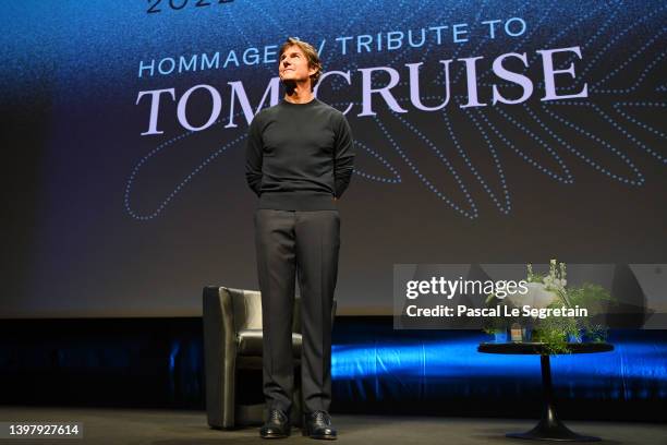 Tom Cruise greets the audience after a rendez-vous with Tom Cruise at the 75th annual Cannes film festival at Palais des Festivals on May 18, 2022 in...