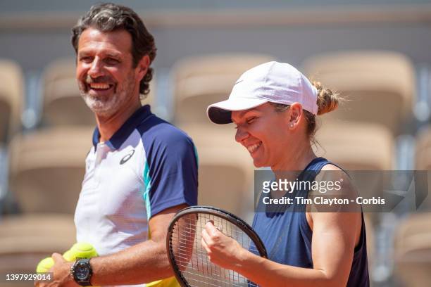 May 18. Simona Halep shares a light hearted moments with coach Patrick Mouratoglou during training on Court Philippe Chatrier in preparation for the...