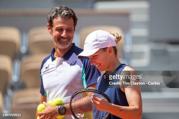 May 18. Simona Halep shares a light hearted moments with coach Patrick Mouratoglou during training on Court Philippe Chatrier in preparation for the...