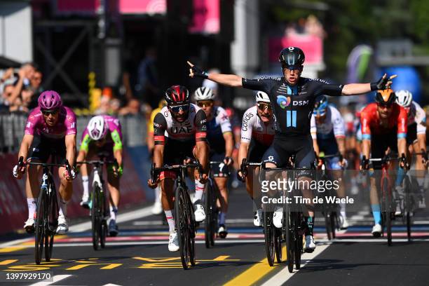 Alberto Dainese of Italy and Team DSM celebrates at finish line as stage winner ahead of Arnaud Demare of France and Team Groupama - FDJ Purple...