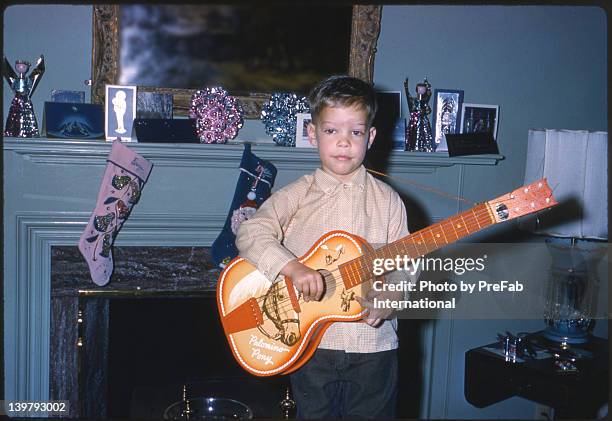 three year old boy with his first guitar 1961 - vintage stockings stock pictures, royalty-free photos & images