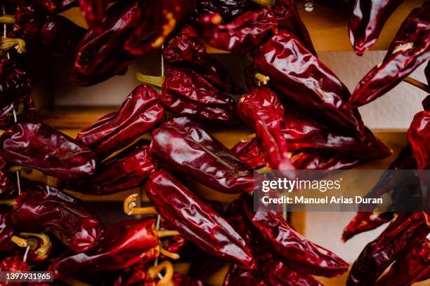 close-up of drying espelette peppers - espelette france photos et images de collection