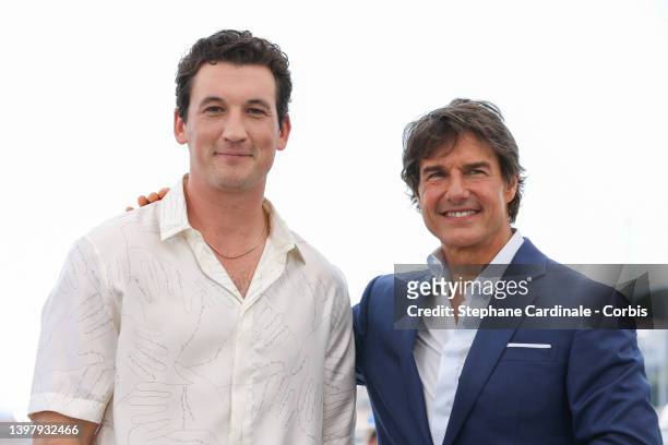 Miles Teller and Tom Cruise attend the photocall of "Top Gun: Maverick" during the 75th annual Cannes film festival at Palais des Festivals on May...