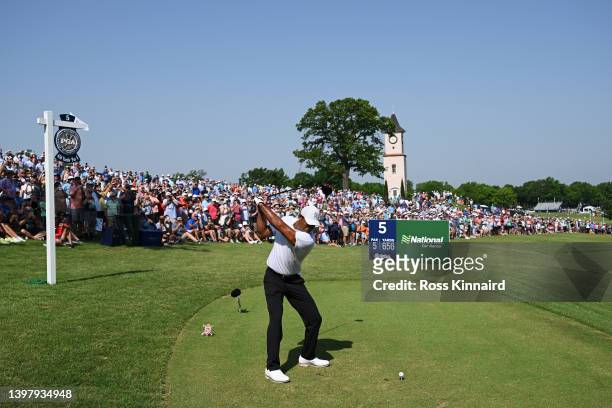 Tiger Woods of the United States plays his shot from the fifth tee during a practice round prior to the start of the 2022 PGA Championship at...