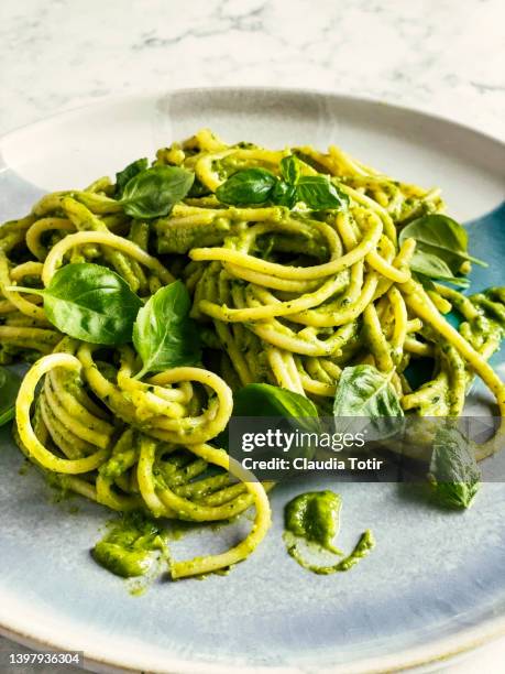 close-up of plate of spaghetti with pesto - pesto sauce stock pictures, royalty-free photos & images