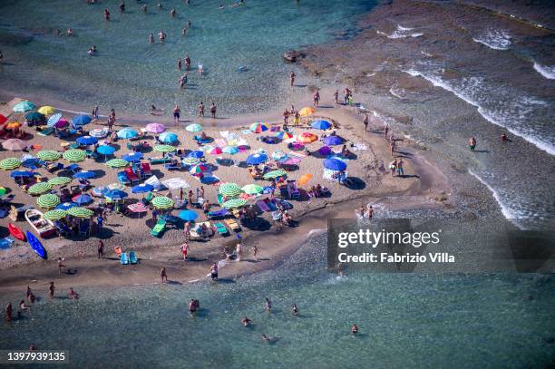 Aerial view, from a helicopter, of golden sands and crystal-clear sea at typical natural beaches in the province of Siracusa in Sicily on August 11,...