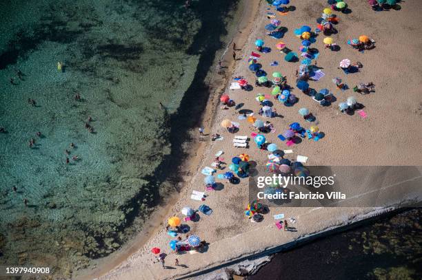 Aerial view, from a helicopter, of golden sands and crystal-clear sea at typical natural beaches in the province of Siracusa in Sicily on August 11,...