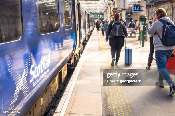 scotrail train arrival at edinburgh waverley - walking personal perspective stock pictures, royalty-free photos & images