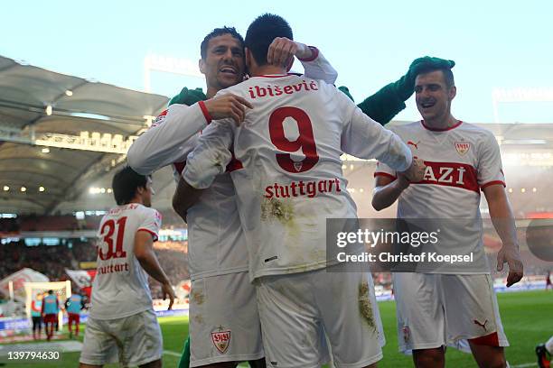 Khalid Boulahrouz of Stuttgart celebrates the third goal with Veddad Ibisevic and Zdravko Kuzmanovic during the Bundesliga match between VfB...