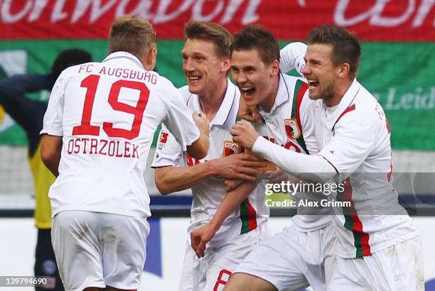 Thorsten Oehrl of Augsburg celebrates his team's second goal with team mates Matthias Ostrzolek, Axel Bellinghausen and Daniel Baier during the...