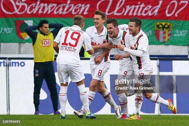Thorsten Oehrl of Augsburg celebrates his team's second goal with team mates Matthias Ostrzolek, Axel Bellinghausen and Daniel Baier during the...