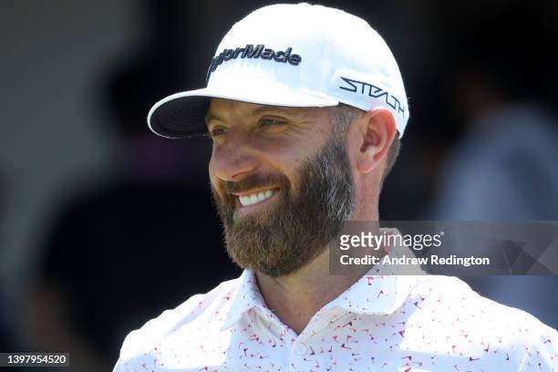 Dustin Johnson of the United States smiles on the first tee during a practice round prior to the start of the 2022 PGA Championship at Southern Hills...