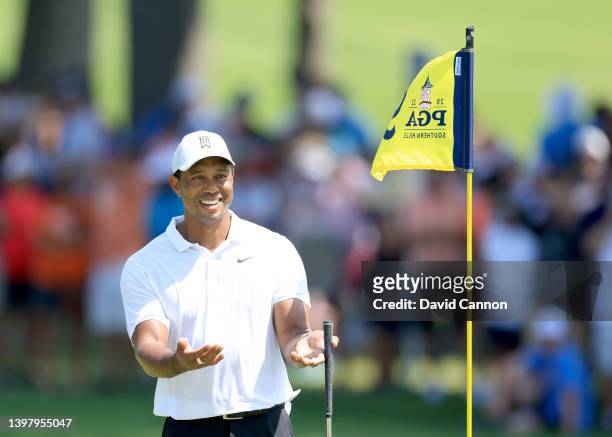 Tiger Woods of The United States is all smiles on the ninth green during practice for the 2022 PGA Championship at Southern Hills Country Club on May...