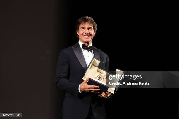 Tom Cruise attends a ceremony as he receives a Palme d'Or during the 75th annual Cannes film festival at Palais des Festivals on May 18, 2022 in...
