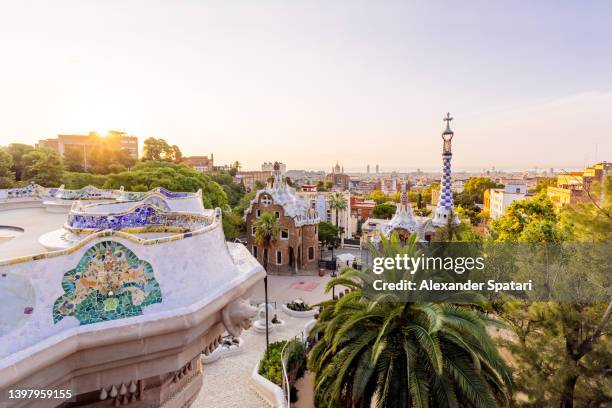 sunrise in barcelona seen from park guell, catalonia, spain - gaudi stock-fotos und bilder