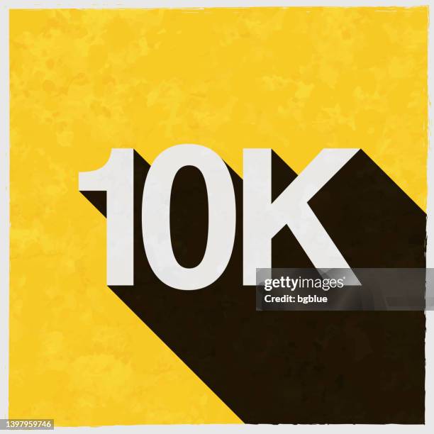 10k, 10000 - ten thousand. icon with long shadow on textured yellow background - 10000 meter stock illustrations