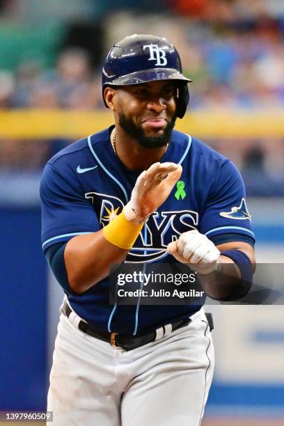 Yandy Diaz of the Tampa Bay Rays reacts after hitting a single in the first inning against the Detroit Tigers at Tropicana Field on May 18, 2022 in...