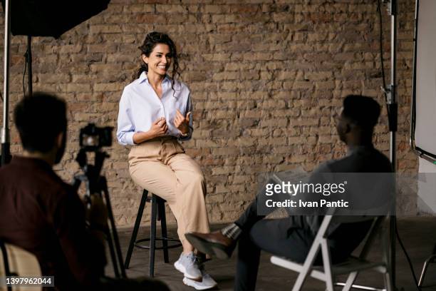 giving an interview in a modest studio - casting call stockfoto's en -beelden