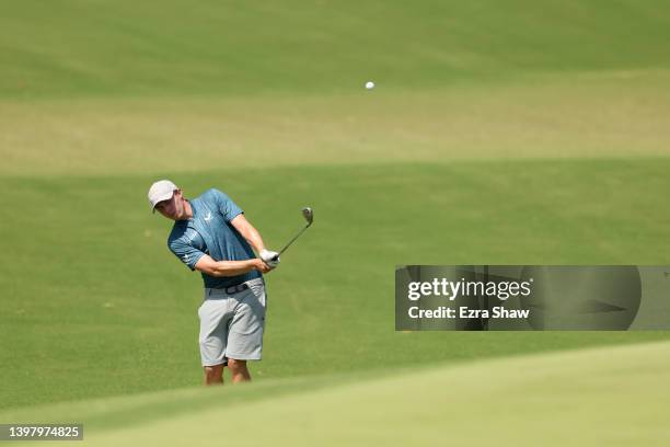 Matt Fitzpatrick of England chips on the 18th green during a practice round prior to the start of the 2022 PGA Championship at Southern Hills Country...