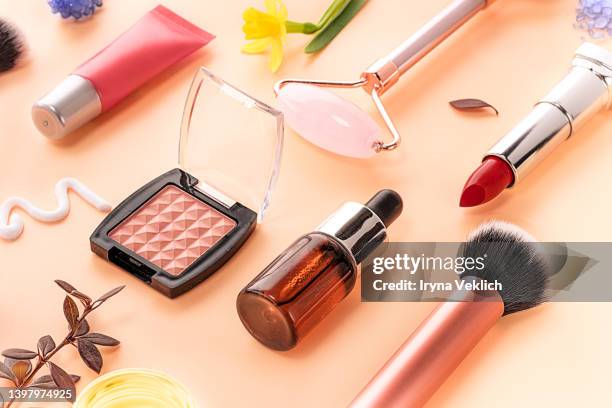collection of beauty products and flowers. - cosmetic products stock pictures, royalty-free photos & images