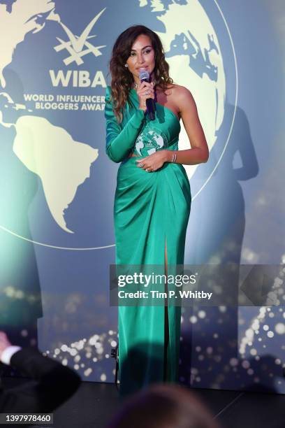 Award winner Madalina Ghenea speaks on stage during the World Influencers and Bloggers Awards 2022 at Hotel Martinez on May 18, 2022 in Cannes,...