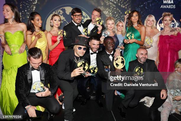 Award winners pose with their awards after during the World Influencers and Bloggers Awards 2022 at Hotel Martinez on May 18, 2022 in Cannes, France.