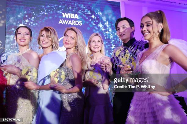Award winners pose with their awards after during the World Influencers and Bloggers Awards 2022 at Hotel Martinez on May 18, 2022 in Cannes, France.