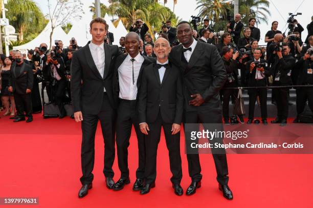 Jonas Bloquet, Alassane Diong, Mathieu Vadepied and Omar Sy attend the screening of "Top Gun: Maverick" during the 75th annual Cannes film festival...