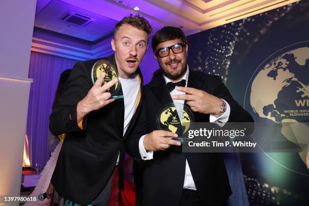 Award winners Ievgen Klopotenko and Mykola Udianskyi pose with their awards at the World Influencers and Bloggers Awards 2022 at Hotel Martinez on...