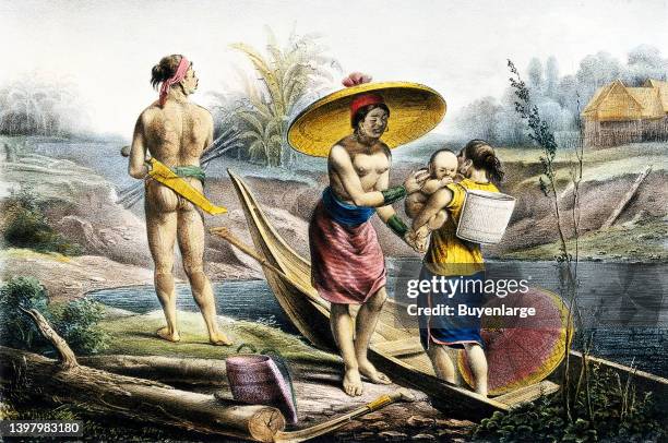 Dyak woman in a canoe is handing her child to a woman on the river bank; a tattooed man is holding various objects. Lithograph by H.A. Henrici and...
