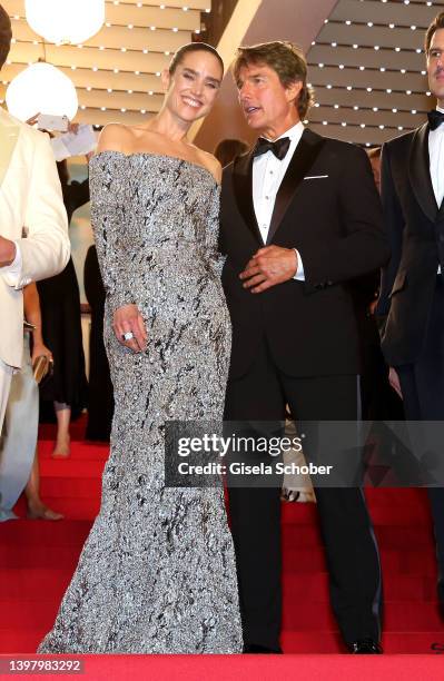 Jennifer Connelly and Tom Cruise leave the screening of "Top Gun: Maverick" during the 75th annual Cannes film festival at Palais des Festivals on...