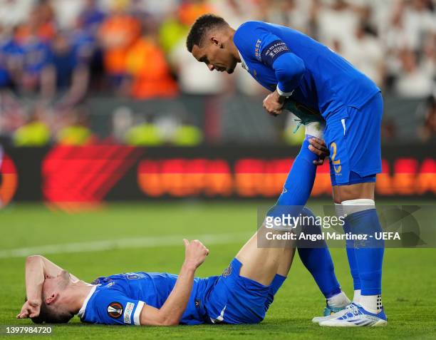 Borna Barisic is assisted by James Tavernier of Rangers during the UEFA Europa League final match between Eintracht Frankfurt and Rangers FC at...